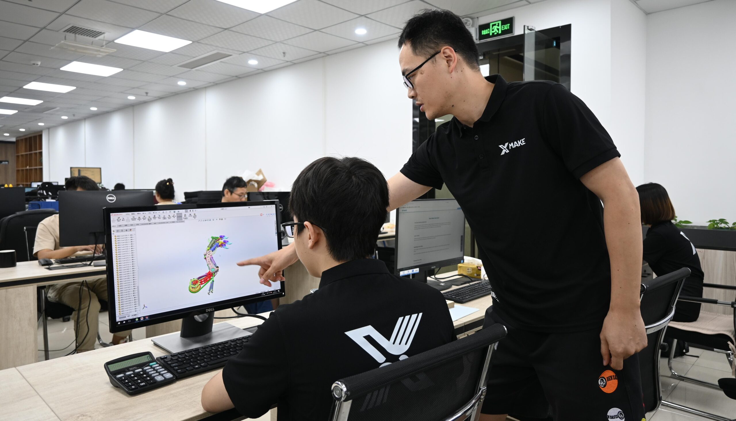 Xmake Engineers Working on Custom Parts